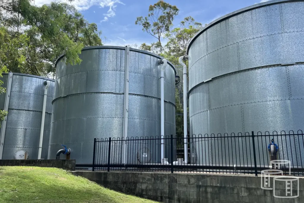 Large galvanized steel water tanks installed outdoors