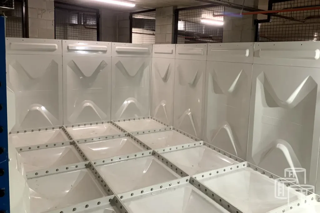 Industrial GRP panel tank undergoing refurbishment