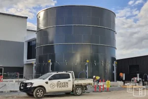 Certified engineer inspecting water tank for AS1851 compliance