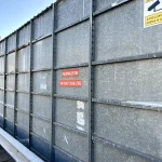 Steel water tank surface showing early signs of corrosion